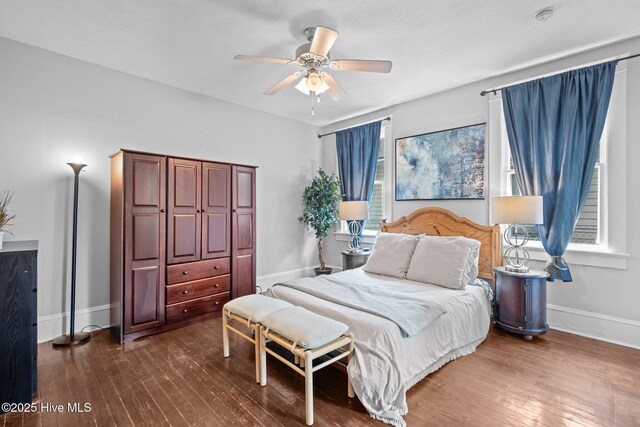 210 S 17th St, Wilmington, NC 28401 - bedroom with dark wood-style floors, baseboards, and ceiling fan