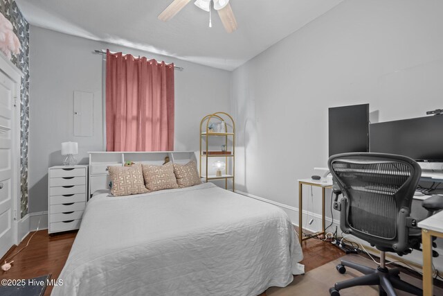 210 S 17th St, Wilmington, NC 28401 - bedroom featuring wood finished floors, an office area, baseboards, and ceiling fan