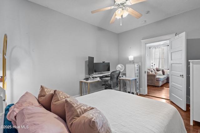 210 S 17th St, Wilmington, NC 28401 - bedroom with wood finished floors, an office area, and a ceiling fan