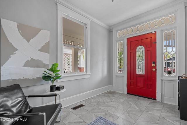 210 S 17th St, Wilmington, NC 28401 - entryway with crown molding, baseboards, and light marble finish floors