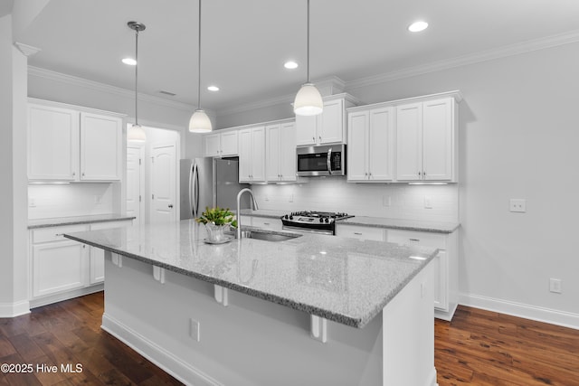 kitchen with a sink, white cabinets, and stainless steel appliances