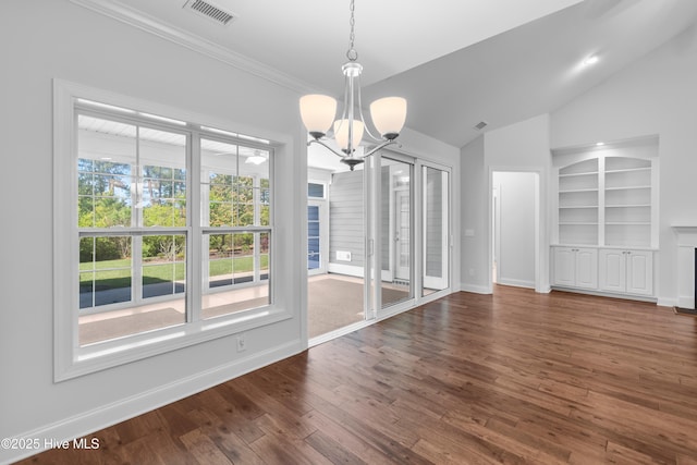 unfurnished dining area featuring a notable chandelier, visible vents, built in features, and baseboards