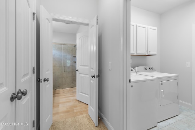 laundry area featuring cabinet space and washing machine and dryer