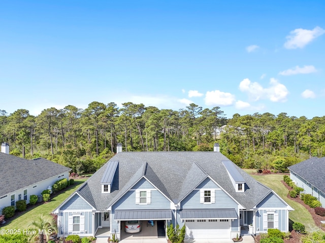 aerial view featuring a wooded view