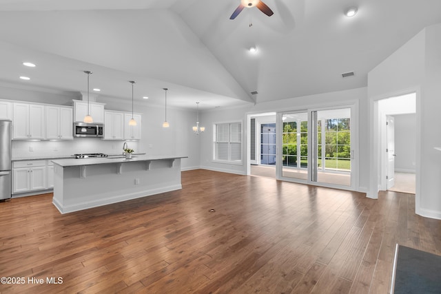 unfurnished living room with a sink, wood-type flooring, a ceiling fan, and recessed lighting