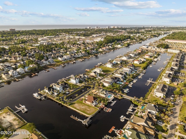 drone / aerial view with a residential view and a water view