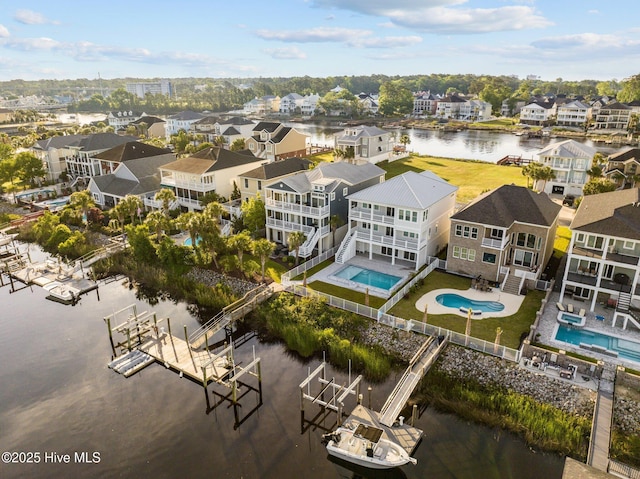 aerial view with a water view and a residential view