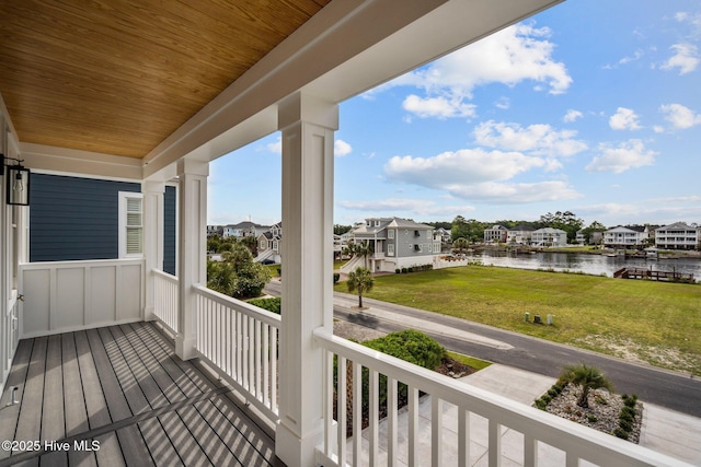 balcony with a water view and a residential view