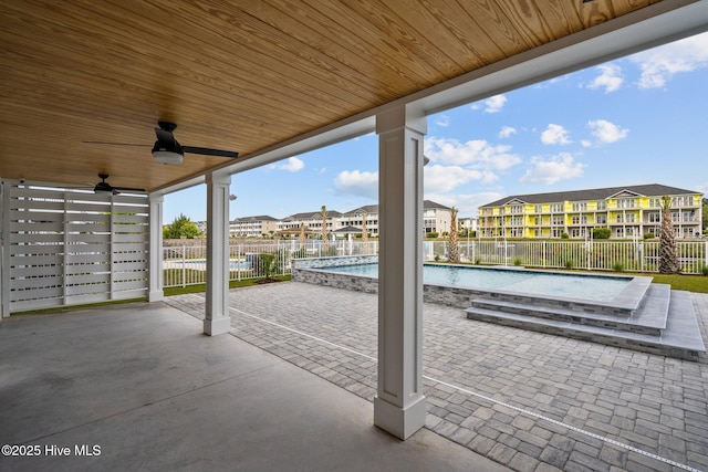 view of patio with a residential view, a fenced in pool, ceiling fan, and a fenced backyard