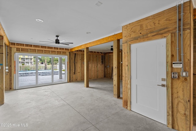 spare room with concrete floors and ceiling fan