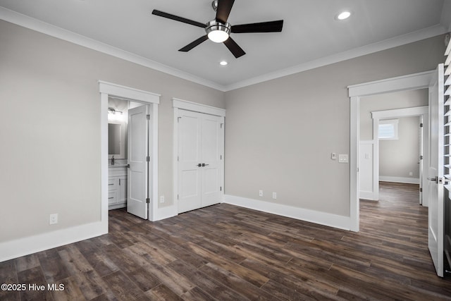 unfurnished bedroom featuring ornamental molding, recessed lighting, dark wood-type flooring, and baseboards
