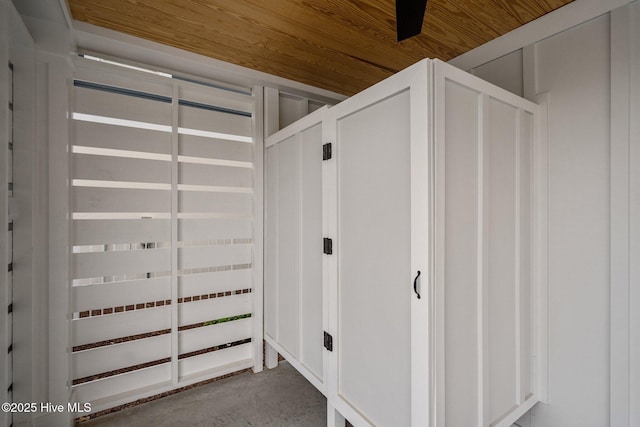 interior space featuring unfinished concrete flooring