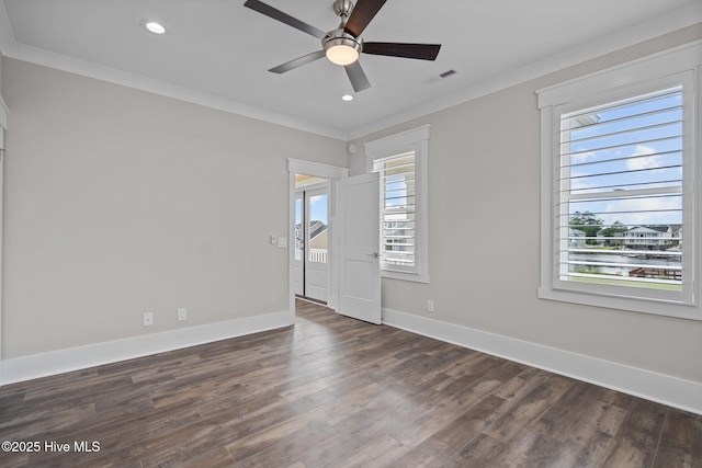 spare room featuring recessed lighting, ornamental molding, ceiling fan, dark wood-style flooring, and baseboards