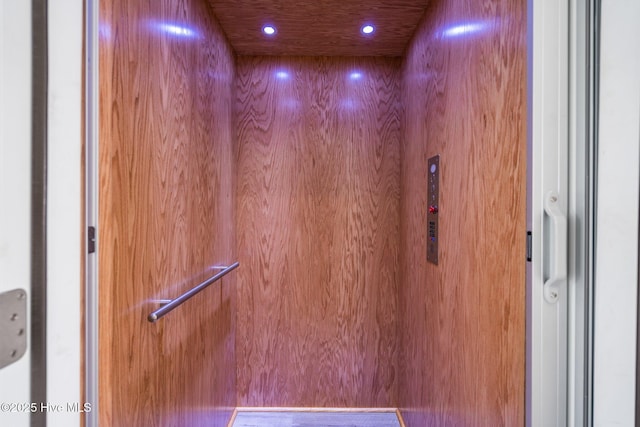 details featuring recessed lighting and elevator