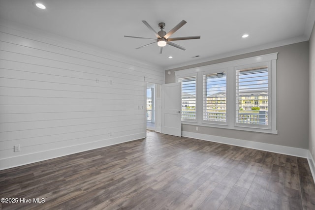 empty room with crown molding, baseboards, recessed lighting, dark wood finished floors, and a ceiling fan