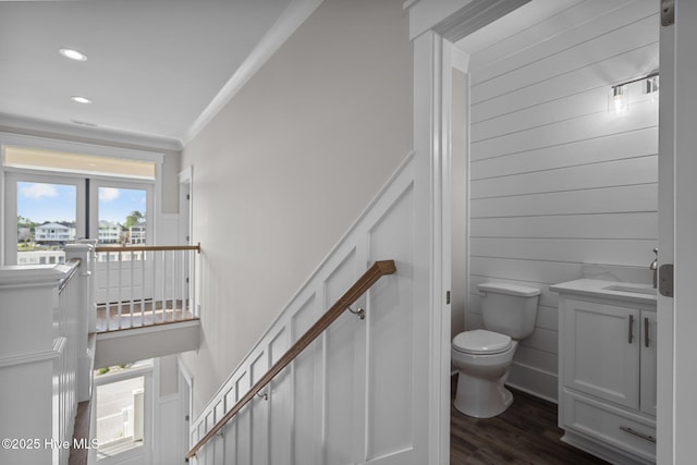 bathroom with recessed lighting, wood finished floors, toilet, and vanity