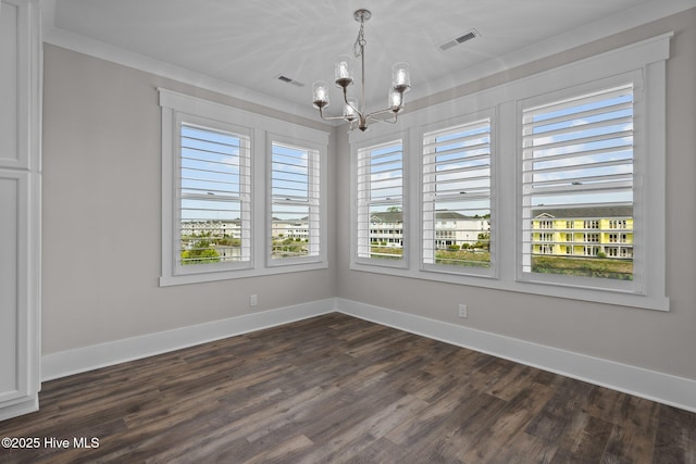 unfurnished dining area featuring dark wood-style floors, a notable chandelier, baseboards, and visible vents