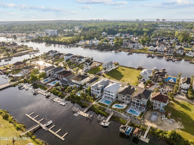 bird's eye view with a water view and a residential view