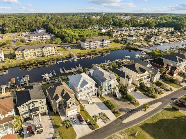 birds eye view of property featuring a residential view and a water view