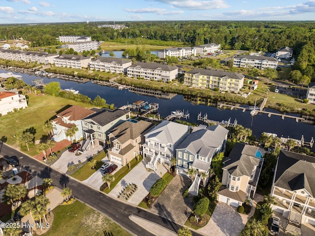 birds eye view of property featuring a water view and a residential view