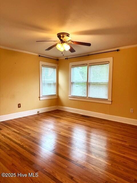 407 Main St, Bayboro, NC 28515 - unfurnished room featuring ceiling fan, ornamental molding, baseboards, and wood finished floors
