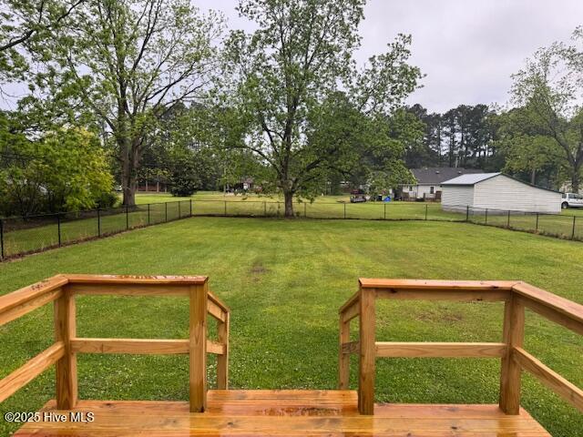 407 Main St, Bayboro, NC 28515 - view of yard featuring a deck and a fenced backyard
