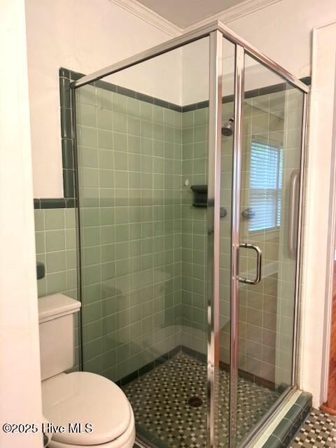 407 Main St, Bayboro, NC 28515 - full bath with crown molding, toilet, a shower stall, and tile patterned flooring