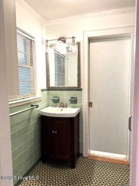 407 Main St, Bayboro, NC 28515 - bathroom featuring vanity, ornamental molding, tile patterned floors, and tile walls