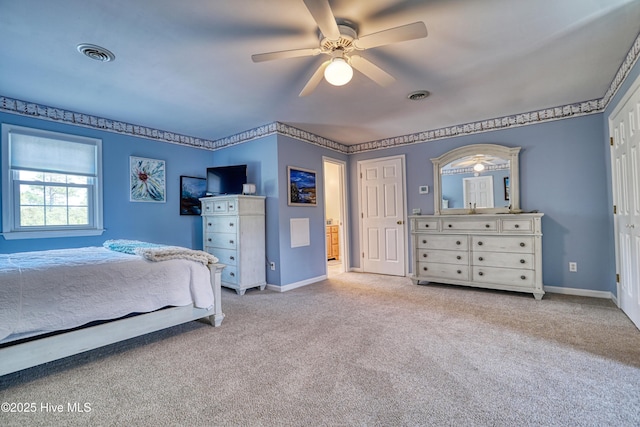 bedroom featuring visible vents, baseboards, a ceiling fan, and carpet floors