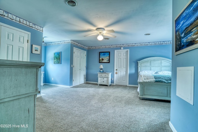 bedroom with baseboards, visible vents, ceiling fan, and carpet floors