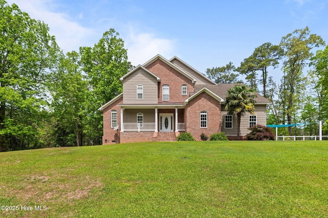 view of front of home with a porch, crawl space, and a front yard