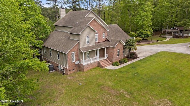 view of front of property with a porch, brick siding, central AC, a chimney, and a shingled roof