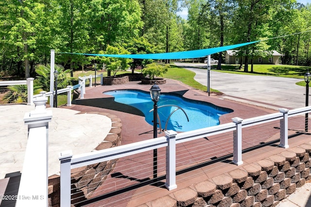 pool featuring a patio area