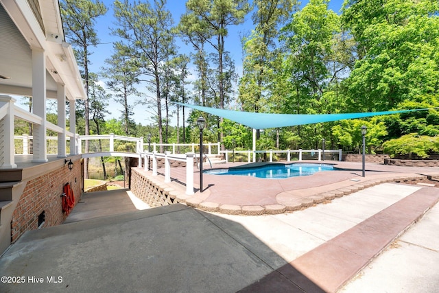 view of pool with a patio and a fenced in pool