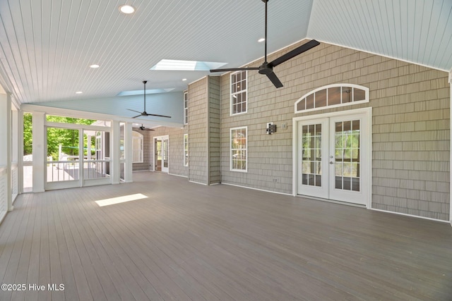 deck with a ceiling fan and french doors