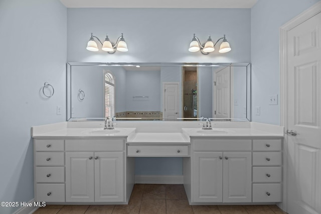full bathroom with a sink, double vanity, a shower stall, and tile patterned floors