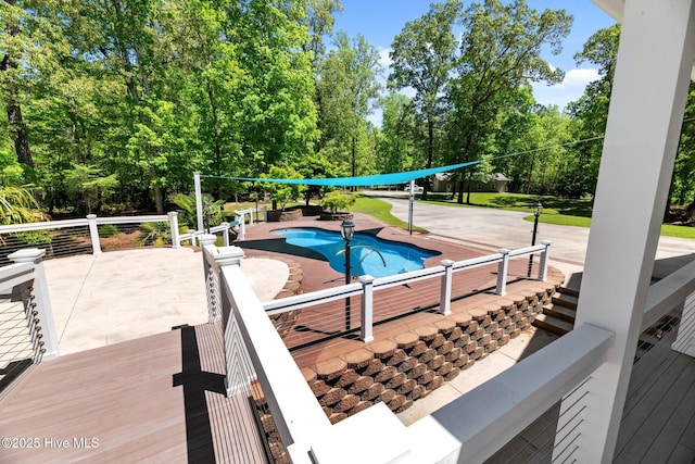 view of swimming pool with a patio area and a fenced in pool