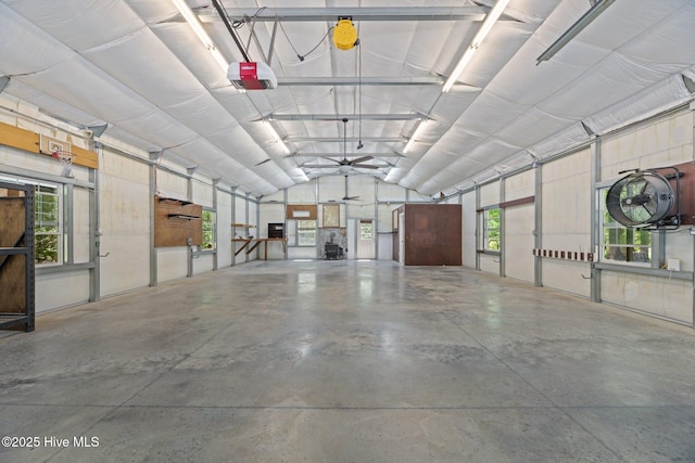 garage featuring a ceiling fan and a garage door opener