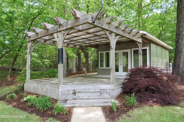 deck featuring a pergola and french doors
