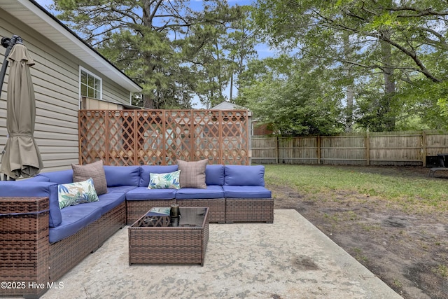 view of patio / terrace featuring an outdoor living space and a fenced backyard