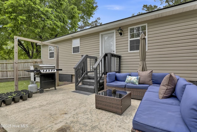 exterior space featuring an outdoor living space, a grill, and fence