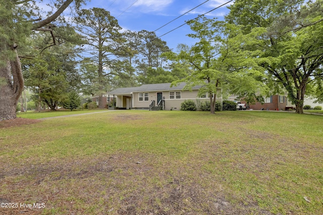ranch-style home with a front lawn and a carport
