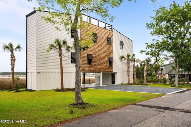 exterior space featuring a front lawn and driveway