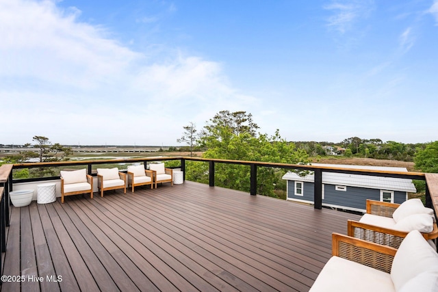 wooden terrace featuring an outdoor living space