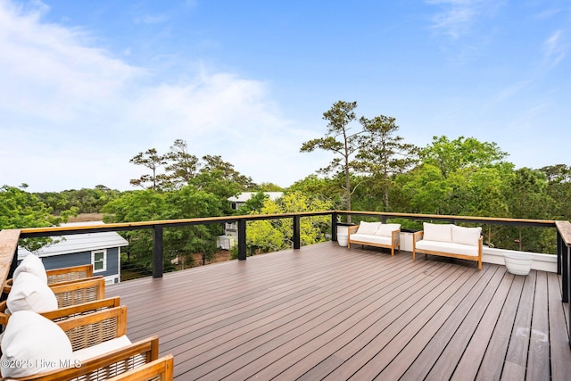 wooden terrace featuring outdoor lounge area