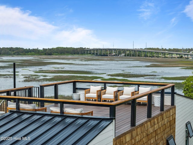view of dock featuring a deck with water view