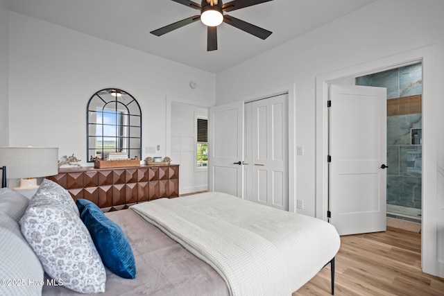 bedroom with light wood finished floors, a closet, and a ceiling fan