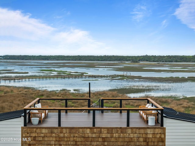 wooden deck with a water view