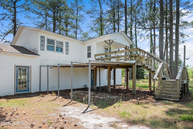 9952 US Highway 17 S, Vanceboro, NC 28586 - back of house featuring stairs, a wooden deck, and a carport
