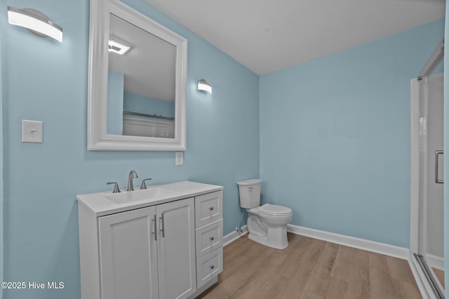 9952 US Highway 17 S, Vanceboro, NC 28586 - bathroom with a shower with curtain, wood finished floors, baseboards, vanity, and toilet
